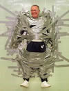 A headteacher .. duck taped to the wall .. what fun ;-)